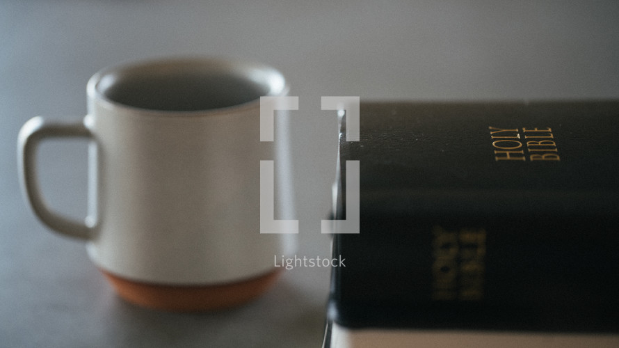 Holy Bible cover and coffee mug