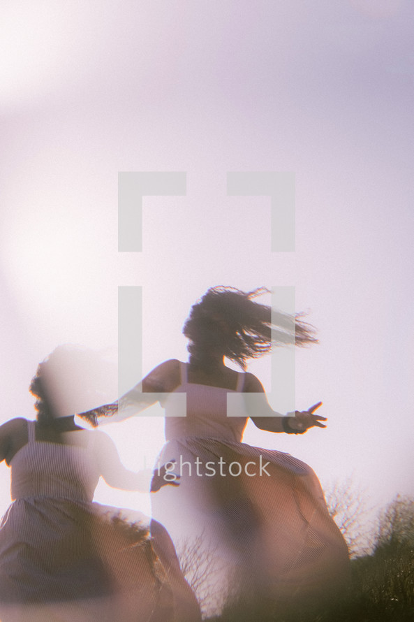 multiple exposure of a woman dancing outdoors 