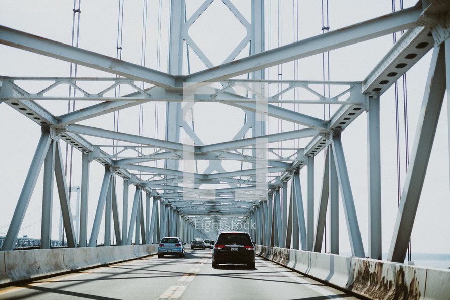 cars crossing over a bridge 