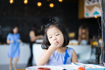 a toddler eating food 