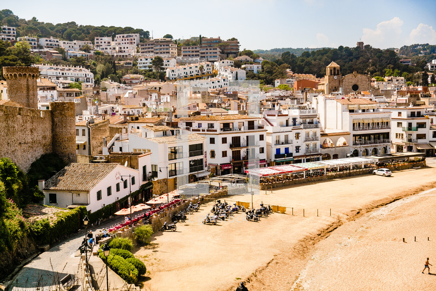 beach and homes on a hillside in Spain 