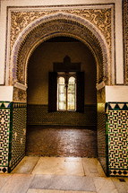 tile work on an arched doorway in Spain 