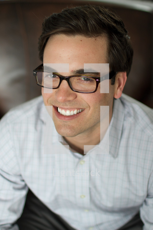 smiling man in glasses