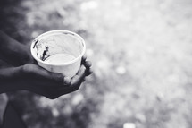 hand holding a cup of water 