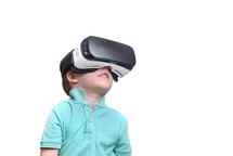 boy wearing virtual reality goggles watching movies or playing video games, isolated on white