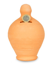 Moneybox made ​​of earthenware on white background