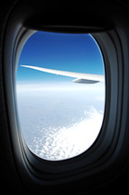 wing of a plane out an airplane window 