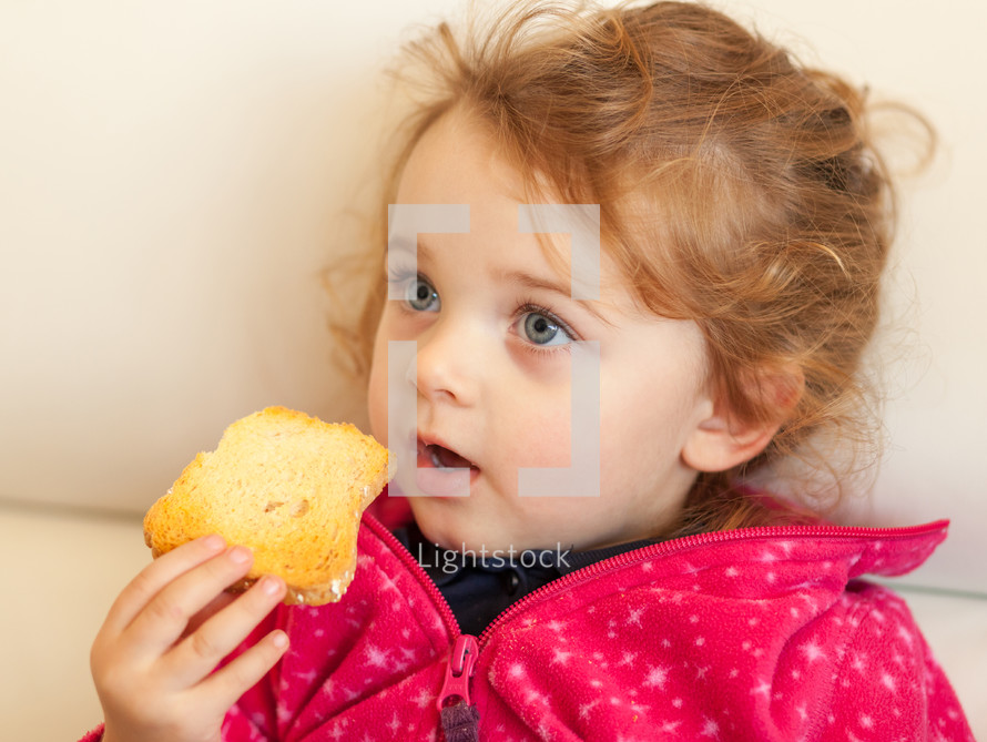 child eating a rusk 