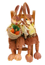 Rabbits sitting on chair straw on white background