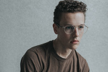 a young man in glasses 