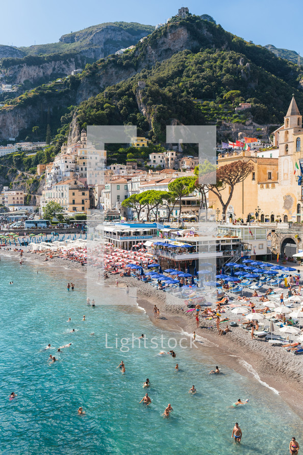 Tourists on the beach of the amalfi coast