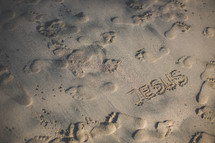 footprints in the sand and the word Jesus 