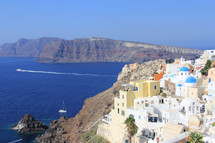 Colorful Greek village overlooking Mediterranean Ocean
