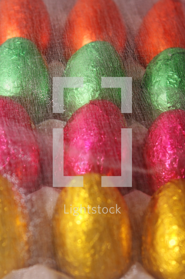 bright foil wrapped chocolate eggs lined up