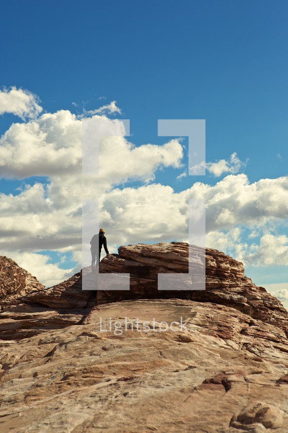 man climbing on a rock in Nevada
