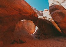 red rock arch and blue sky 