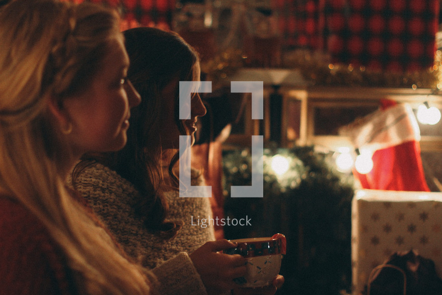 women in conversation while drinking hot cocoa 