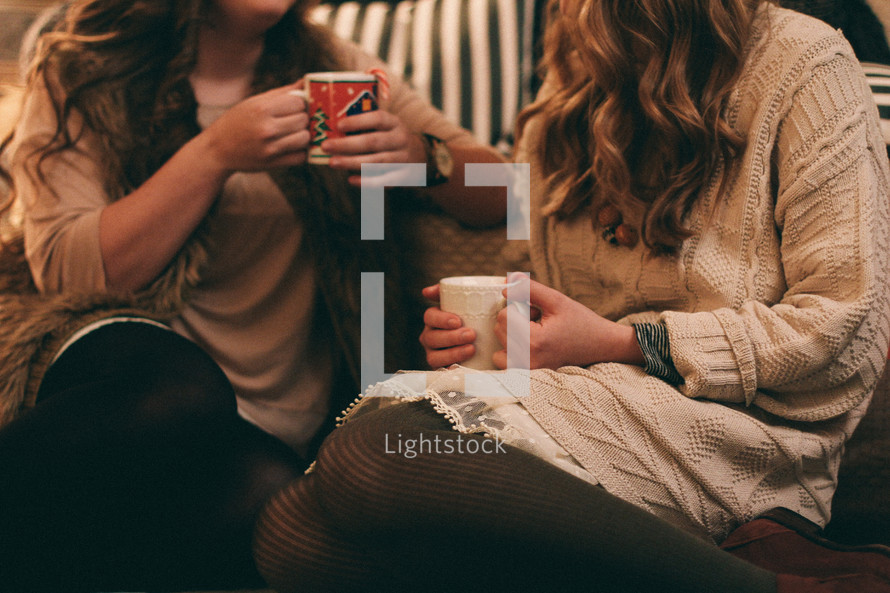 women in conversation drinking hot cocoa 