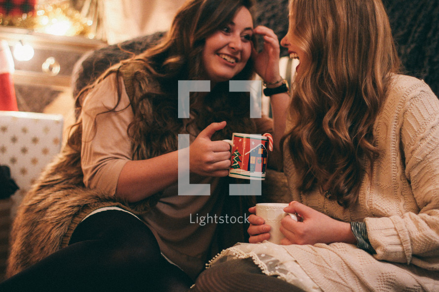 friends in conversation over hot cocoa 