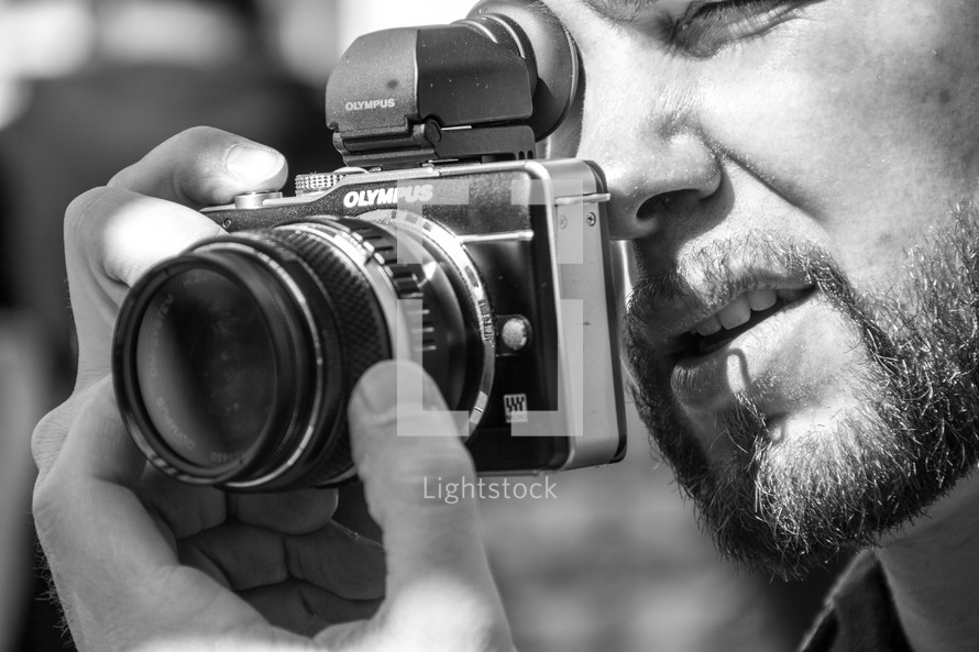 man taking a picture with a camera 