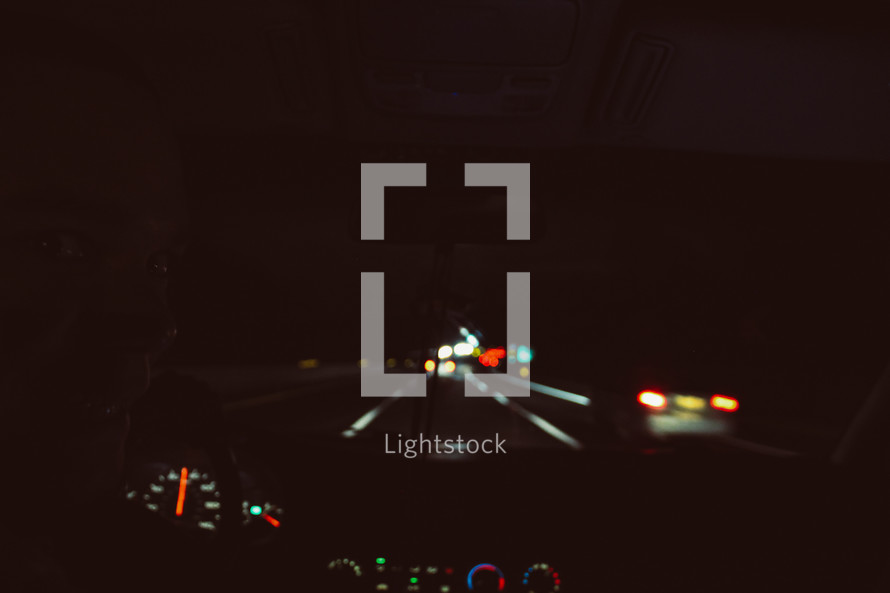 dashboard of a car driving at night 