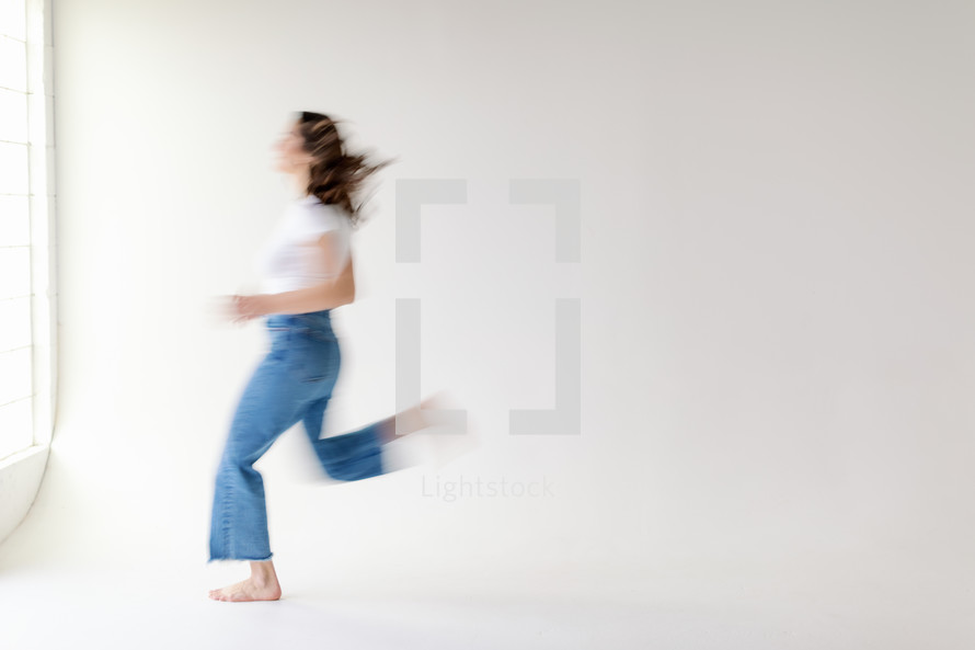 woman running blurry on a white background 