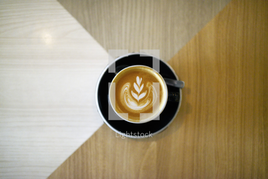 design in creamer in a latte 