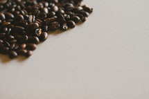 coffee beans on a white surface 