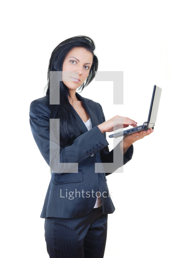a businesswoman holding a laptop computer 