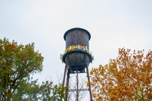 rural water tower and fall trees 