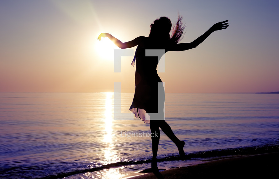 dancer on the beach at sunset 