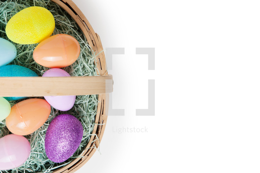 Easter eggs in a basket from an above angle. 