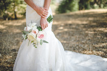Bride's hands holding a bouquet.