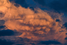 textured clouds glowing in the light of sunset