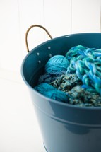 bucket of turquoise yarn 
