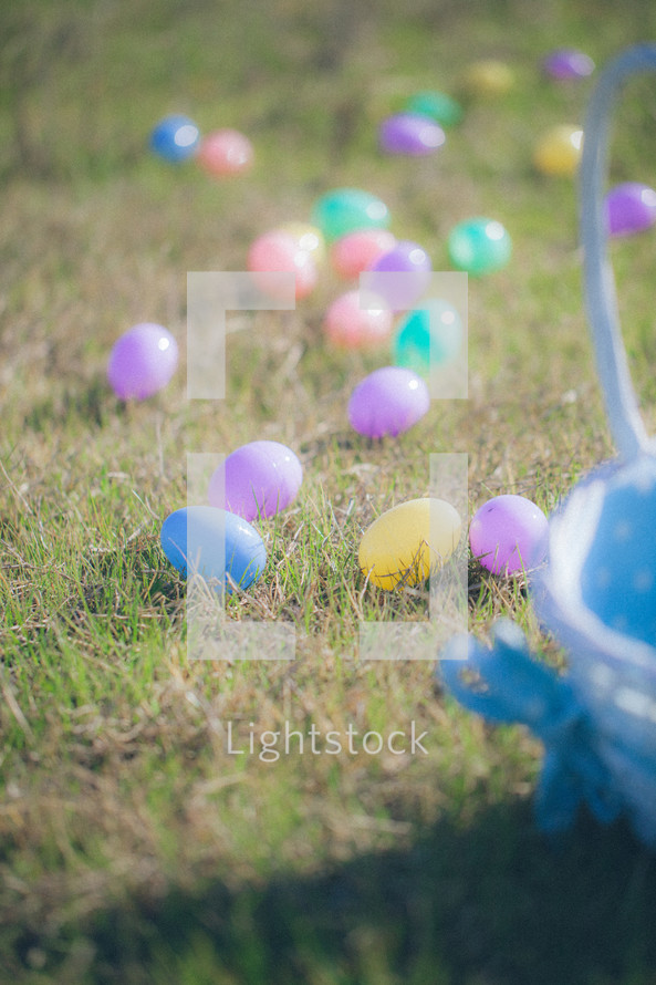 Easter eggs and an Easter basket in the grass