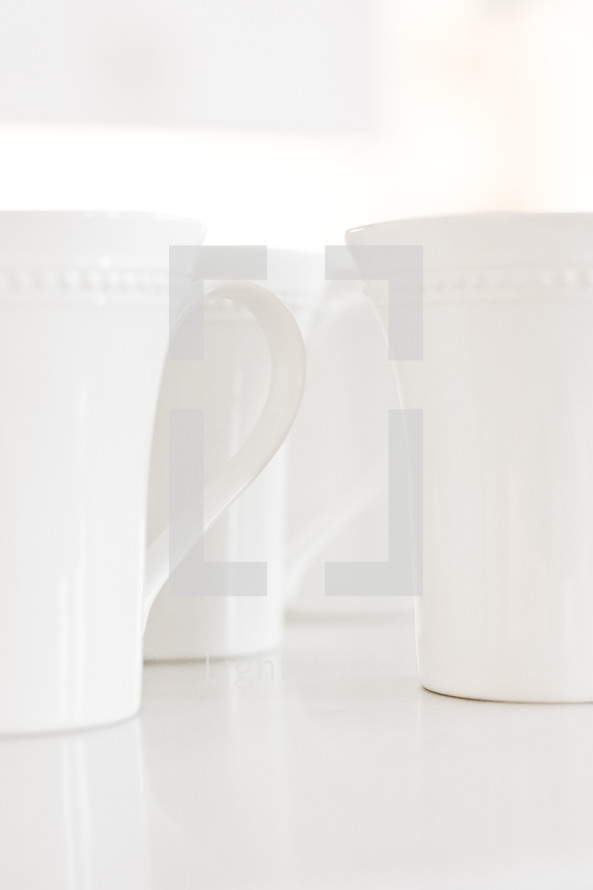 white coffee mugs on a white background 