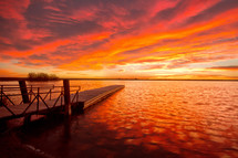 vibrant sky at sunset over a lake 