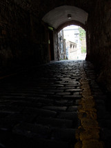 tunnel on a cobble stone street