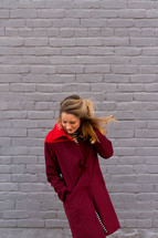 woman in a red coat 