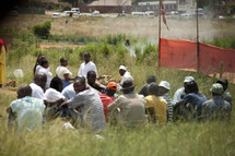 A cult group meets in a field in South Africa