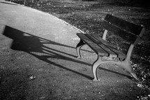 Lonely park bench. Black and white image
