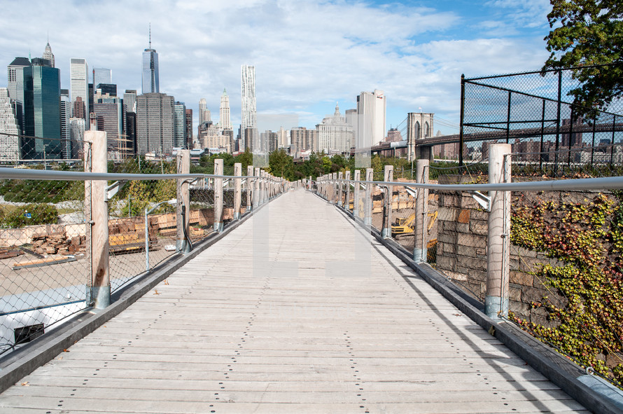 wood walkway and city view 