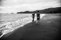 two women walking on a beach