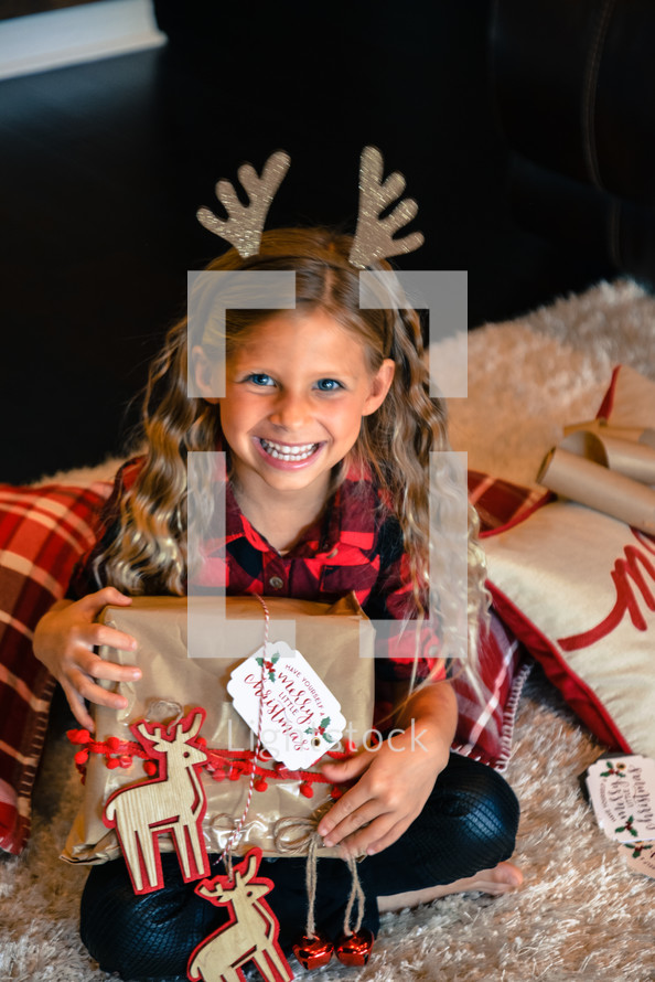 girl child with reindeer antlers 