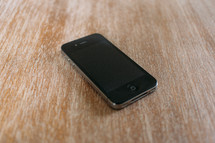 iPhone on a wood floor 