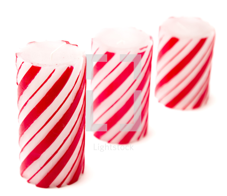 red and white candy cane striped candles 
