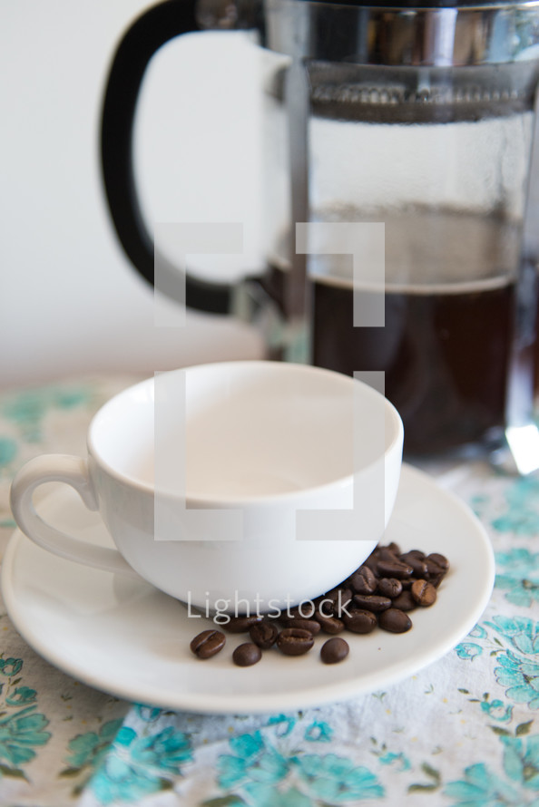 coffee press and cup and saucer 