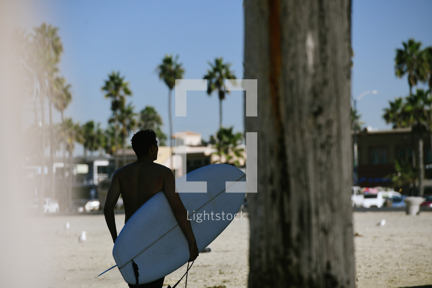 a man with a surfboard 