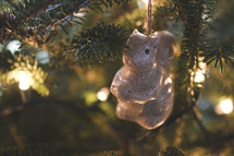 squirrel ornament hanging on a Christmas tree 
